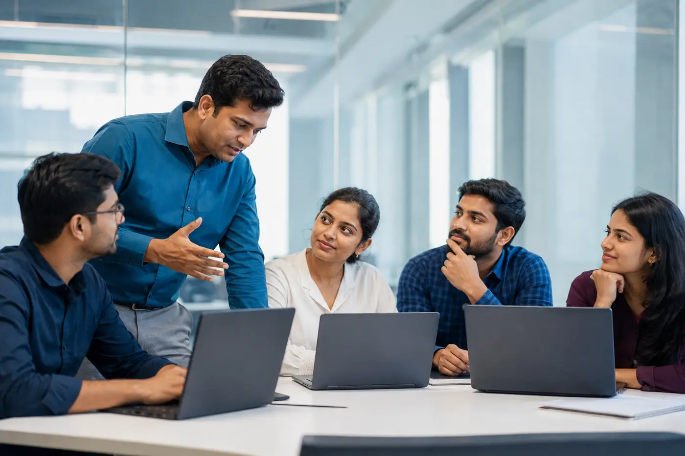 Indian trainer guiding an engaged group of learners